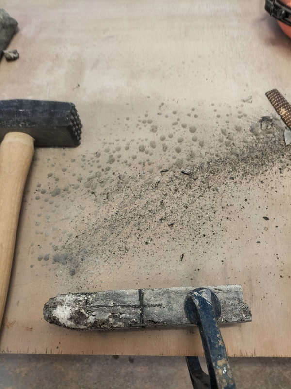 working on the granite with a scutch hammer